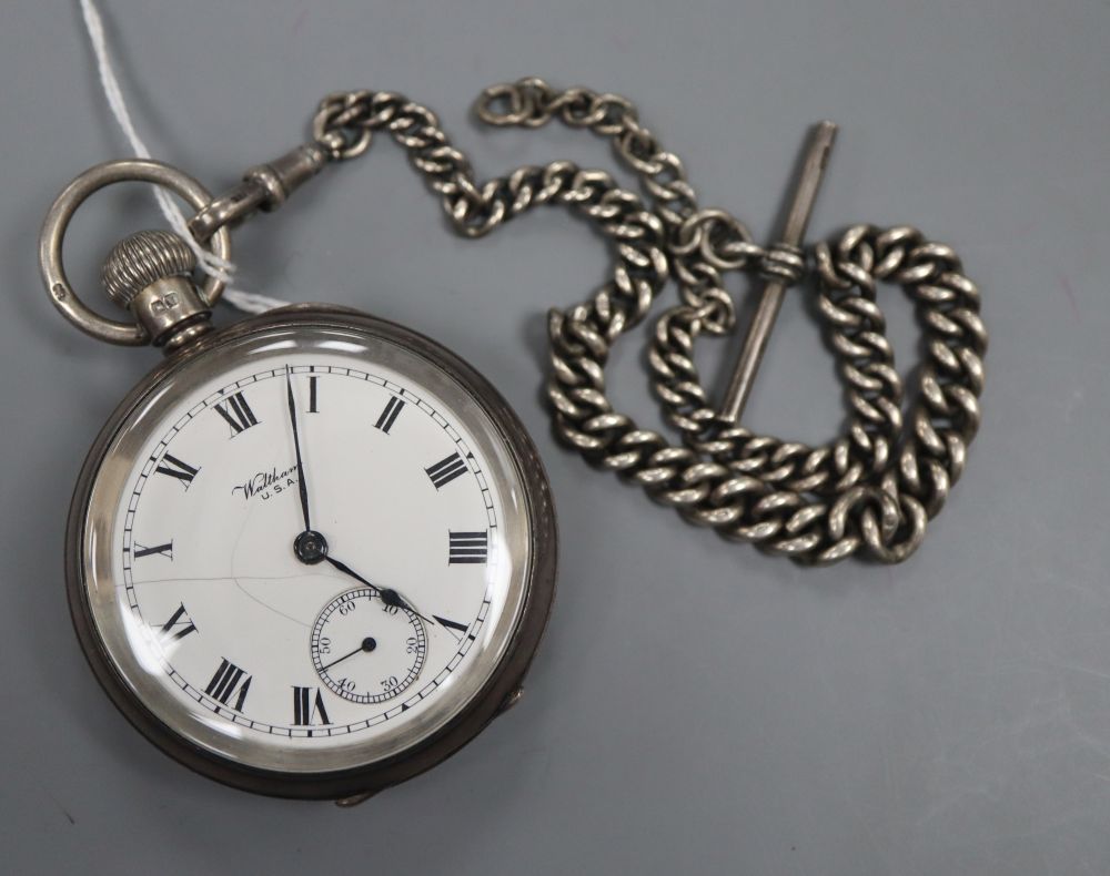A George V silver Waltham keyless pocket watch, case diameter 54mm, dial a.f. and a silver Albert chain.